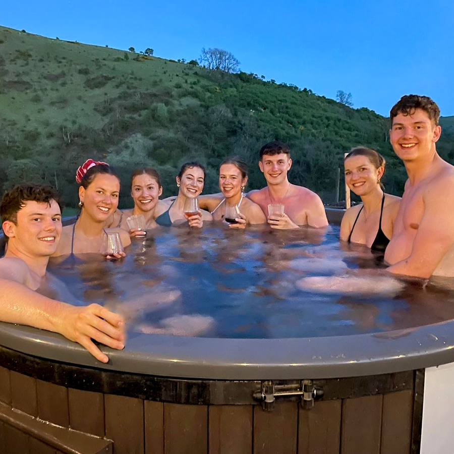 group of friends enjoying hot tub in the peak district